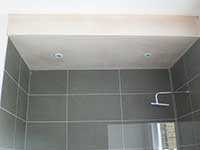 Clapham plasterer plastering a bathroom ceiling in SW11
