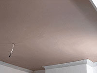 Tooting plasterer havng plasterboarded the ceiling applies a smooth 2 coat plaster finsh