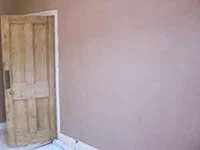 The Earlsfield plasterer plastering lounge walls in SW18